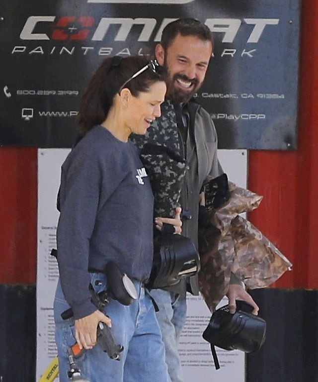 Ben Affleck and Jennifer Garner laugh as they play paintball with their son