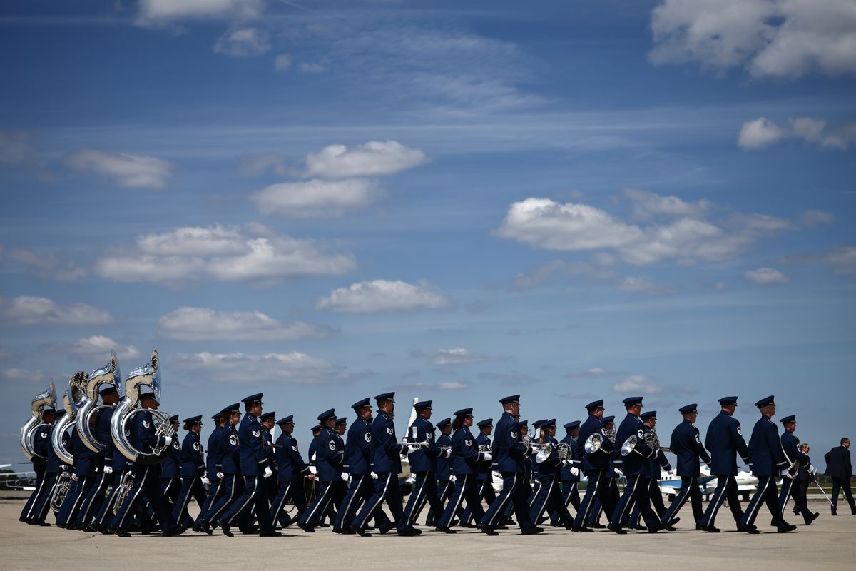 Members of the honor guard march towards the plane as Britain's King Charles III and Queen Camilla arrive on day one of their State Visit to the United States on April 27, 2026 at Joint Base Andrews, Maryland.