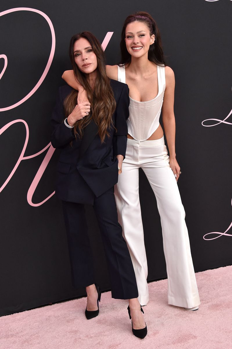 British fashion designer and singer Victoria Beckham and US actress Nicola Peltz