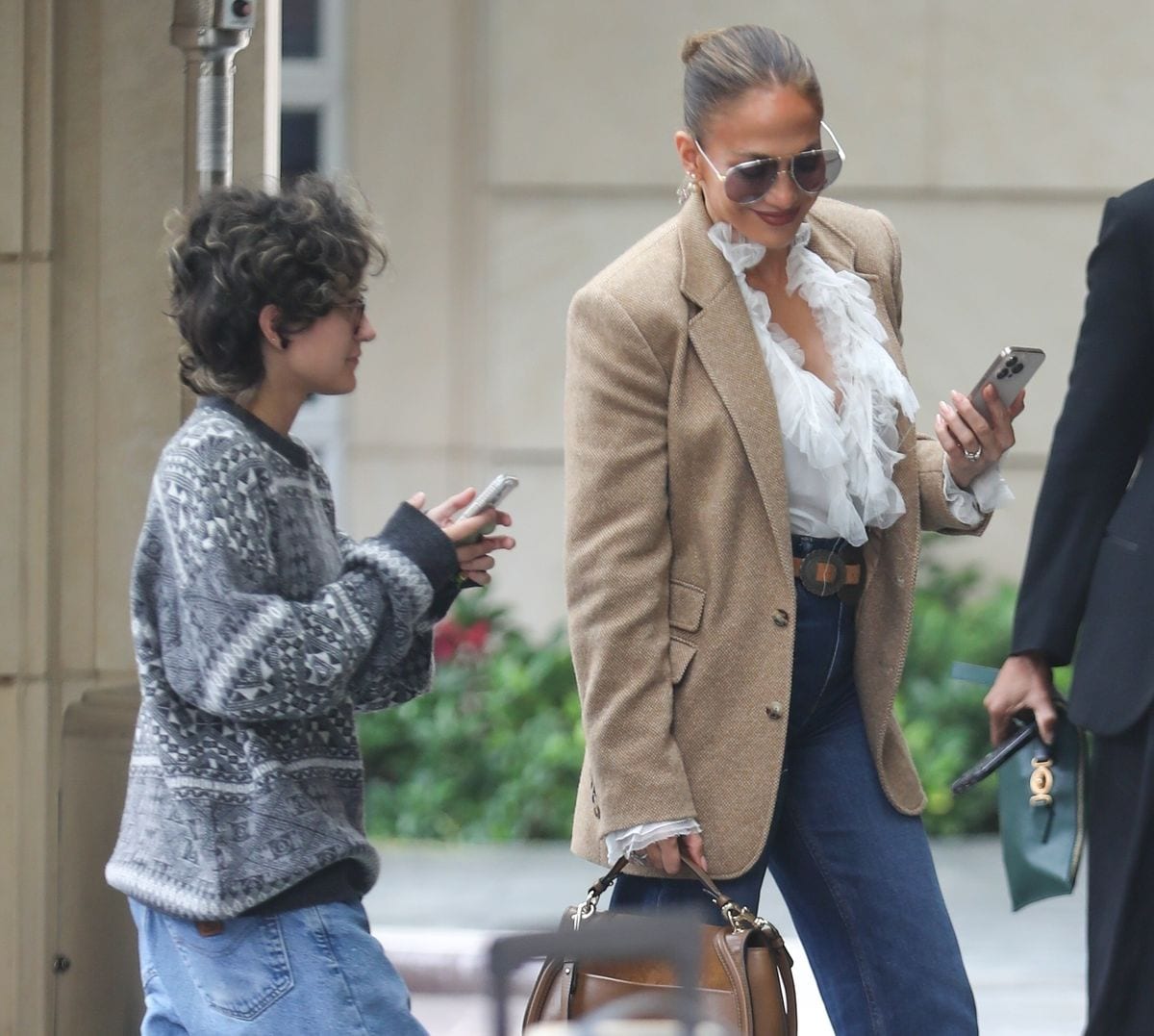 They looked like twins holding their phones