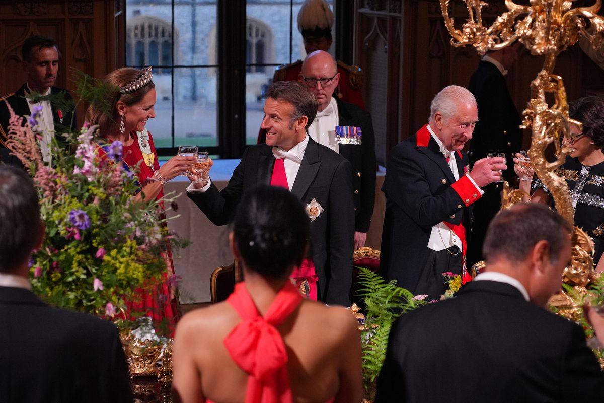Princess of Wales looks on as King Charles III toasts with French President Emmanuel Macron during a state banquet in Windsor, July 8, 2025, the first French state visit to the U.K. since 2008.