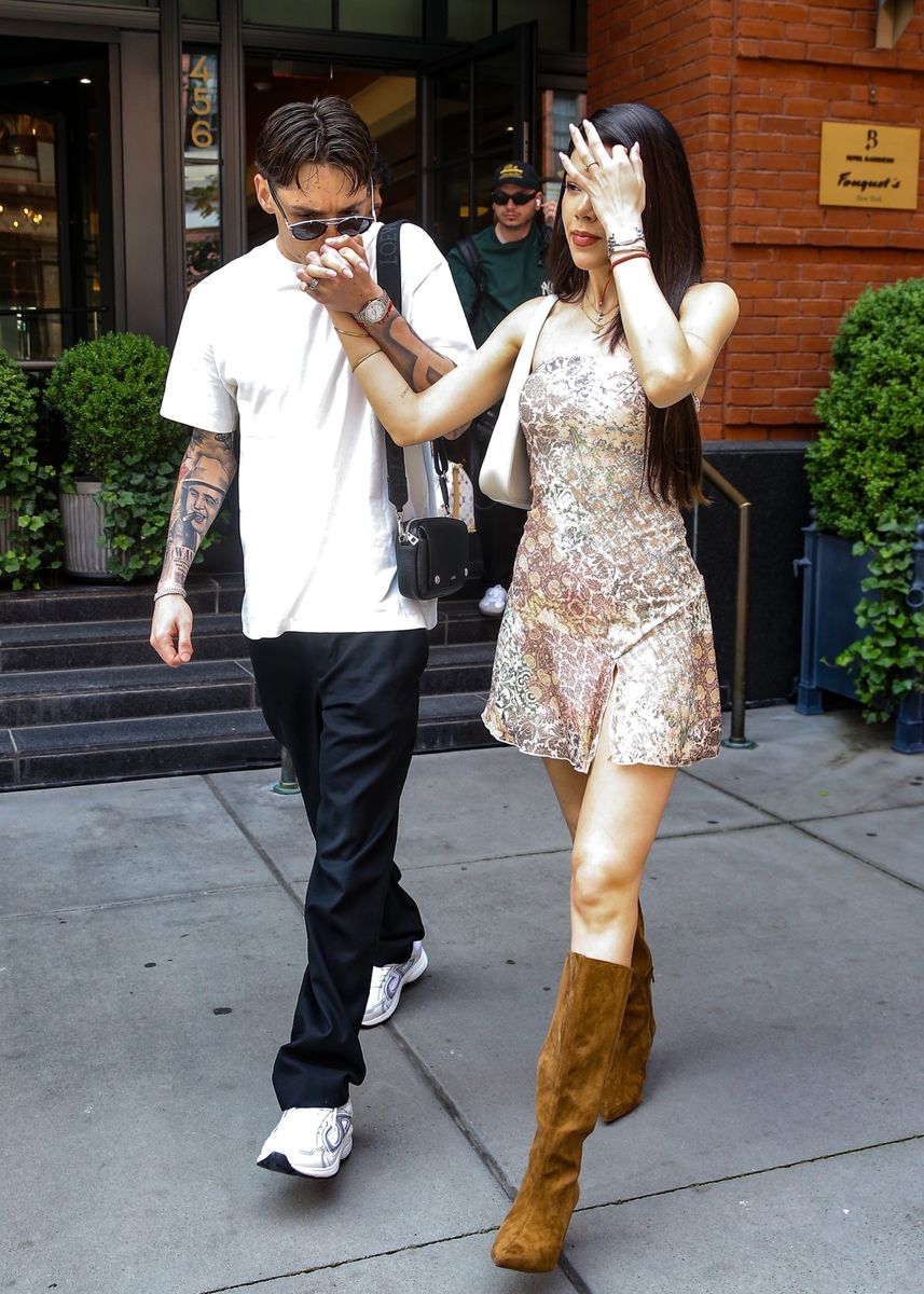 Mexican singer and rapper Peso Pluma and his girlfriend Kenia Os are seen holding hands and kissing in New York.