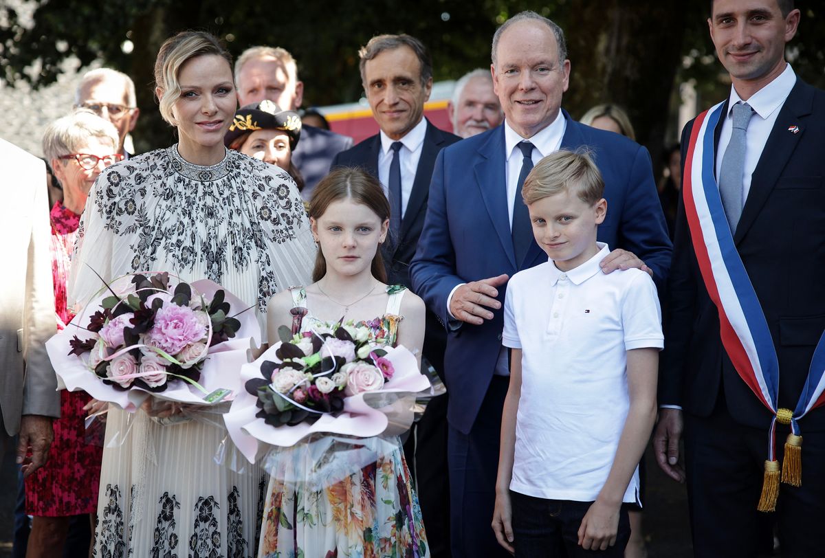 Prince Albert II of Monaco (2ndR), Princess Charlene of Monaco (L) and their children Gabriella and Jacques, pose for a photograph as they arrive in Carladez, a former possession of the Principality of Monaco, in Mur-de-Barrez, southern France on July 9, 2025. (Photo by Valentine CHAPUIS / AFP) / NO TABLOIDS WEB & PRINT, NO DAILY MAIL, NO DAILY MAIL GROUP, NO VOICI, NO CLOSER (Photo by VALENTINE CHAPUIS/AFP via Getty Images)          