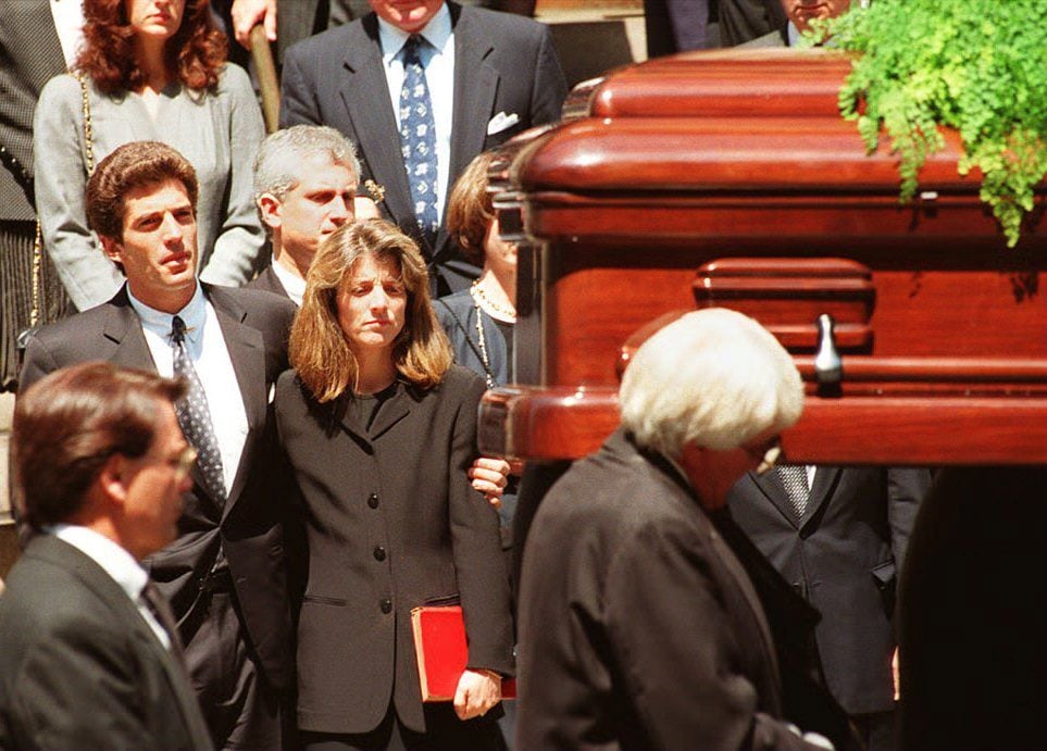 The funeral of Jacqueline Kennedy Onassis at St. Ignatius Loyola Roman Catholic Church in New York City 23 May 1994. To the left of the casket are Mrs. Onassis' children John F. Kennedy Jr. and Caroline Kennedy Schlossberg.