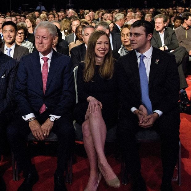 Chelsea (pictured between her dad and husband) praised her mother's performance in the debate.
Photo: BRENDAN SMIALOWSKI/AFP/Getty Images