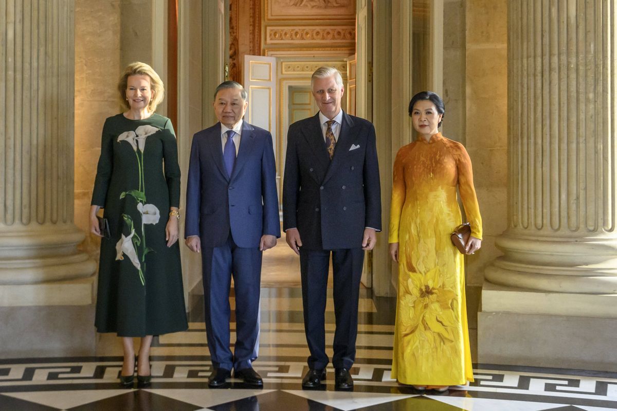 Queen Mathilde of Belgium looked elegant in an emerald-green midi dress featuring oversized white floral details during an official audience at the Castle of Laeken.
