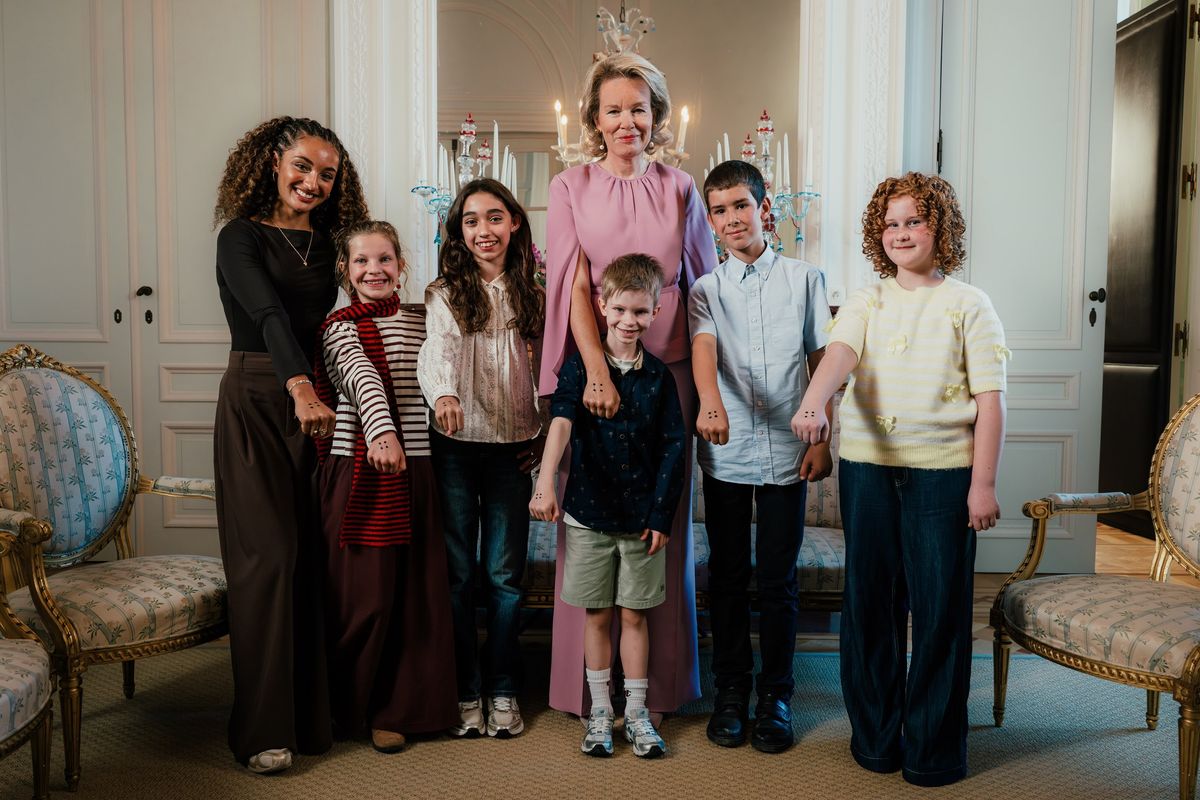 Queen Mathilde opted for an elegant head-to-toe pink look as she welcomed children involved in the STIP IT anti-bullying campaign at the Royal Palace.