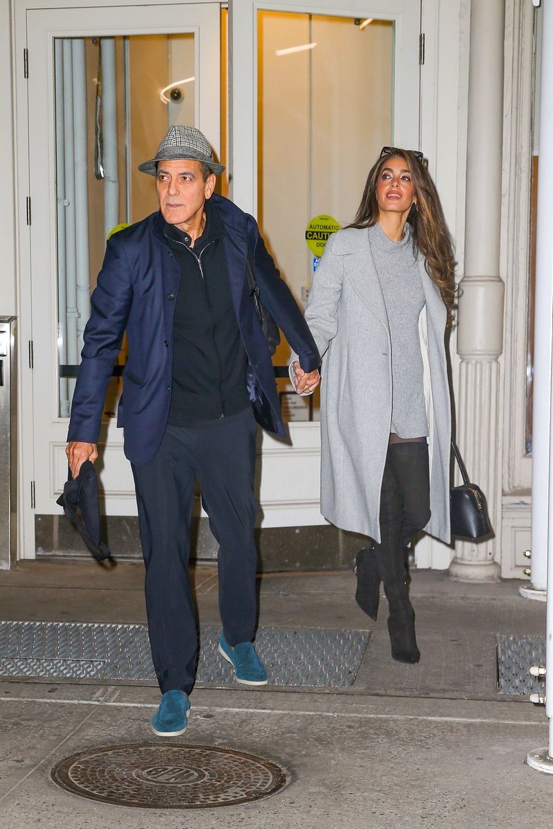 George Clooney and wife Amal Clooney hold hands as they head out together in New York City
