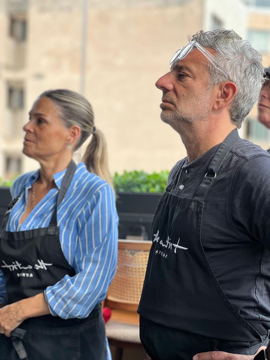 Chefs John DeLucie and Cat Cora immerse themselves in the art of Greek cuisine during a cooking class at The Artist Studio in Athens.