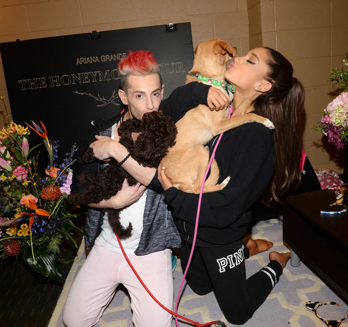 Ariana and her brother Frankie in 2015 backstage with their dogs