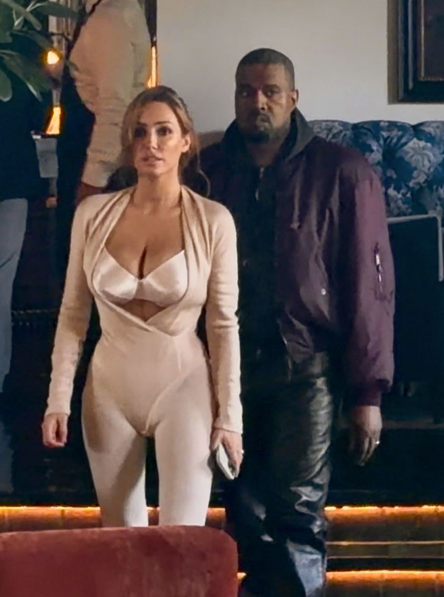 Bianca Censori stepped out in a revealing monochromatic nude look featuring a structured satin bralette-style top with dramatic cutouts