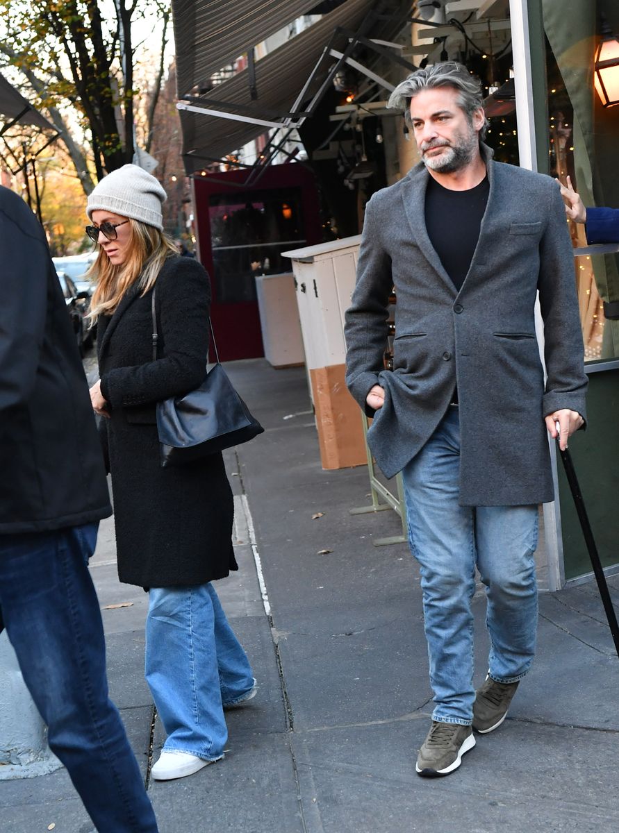 Aniston made the relationship Instagram official, posting a black-and-white photo with her arms wrapped around Curtis.