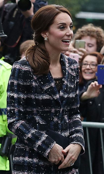 She accessorized the look with pearl earrings and a suede clutch.
Photo: PA