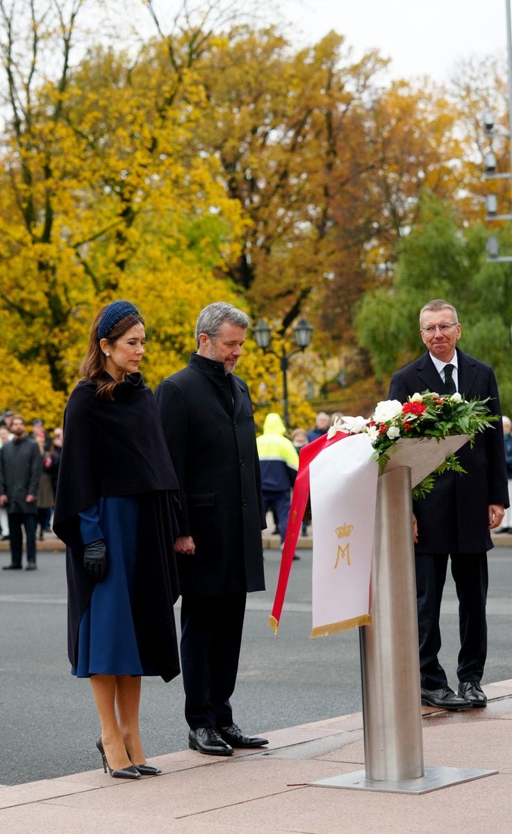 King Frederik X of Denmark (C) and Queen Mary of Denmark (L)  attend a wreath laying ceremony with Latvia's President Edgars Rinkevics (R) at the Freedom Monument in Riga, Latvia, on October 28, 2025. The Danish Royal Couple is on a two-day state visit to Latvia. (Photo by Gints Ivuskans / AFP) (Photo by GINTS IVUSKANS/AFP via Getty Images)