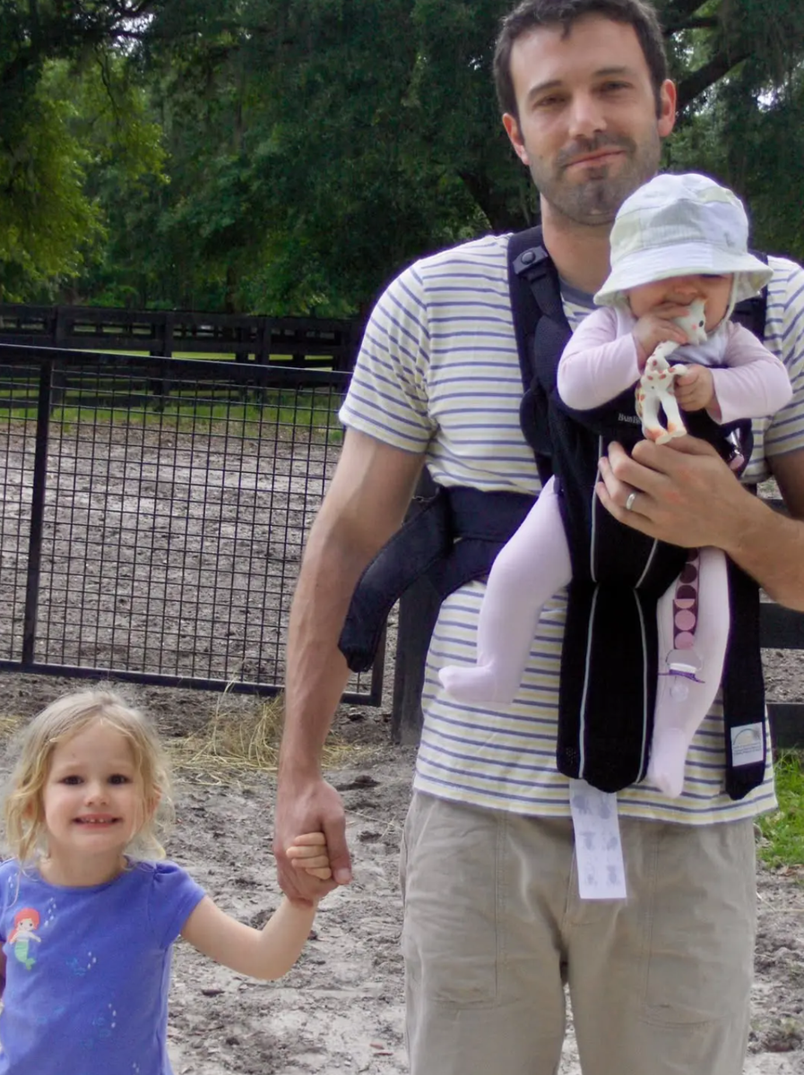 The Oscar winner posing outdoors with daughters Violet and Fin (Seraphina) when they were younger.
