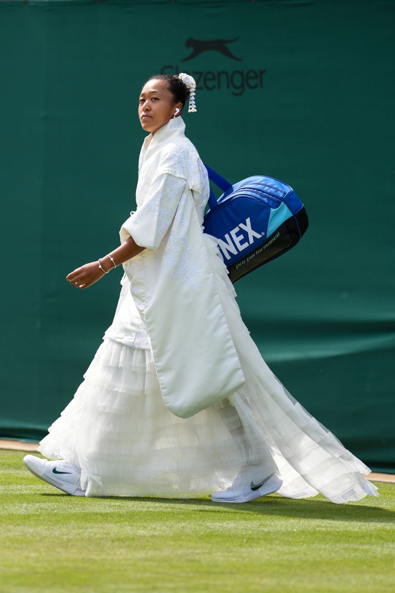 Naomi Osaka of Japan walks to the court before her Ladies Singles first round match against Elsa Jacquemot of France.
