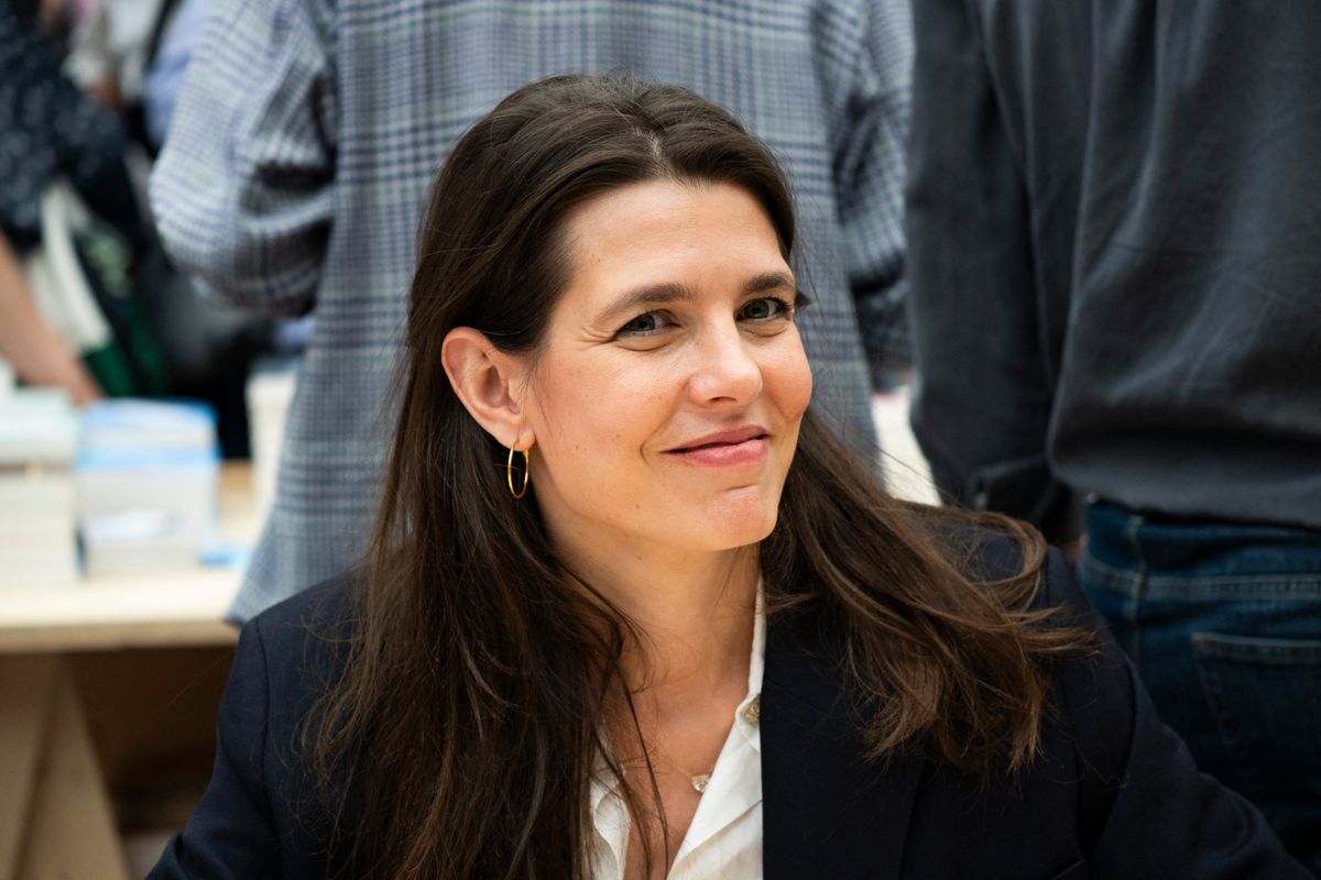 In a rare departure from her signature "no jewelry" rule, Casiraghi adds a subtle point of light with medium-sized gold hoops to complement her morning ensemble.