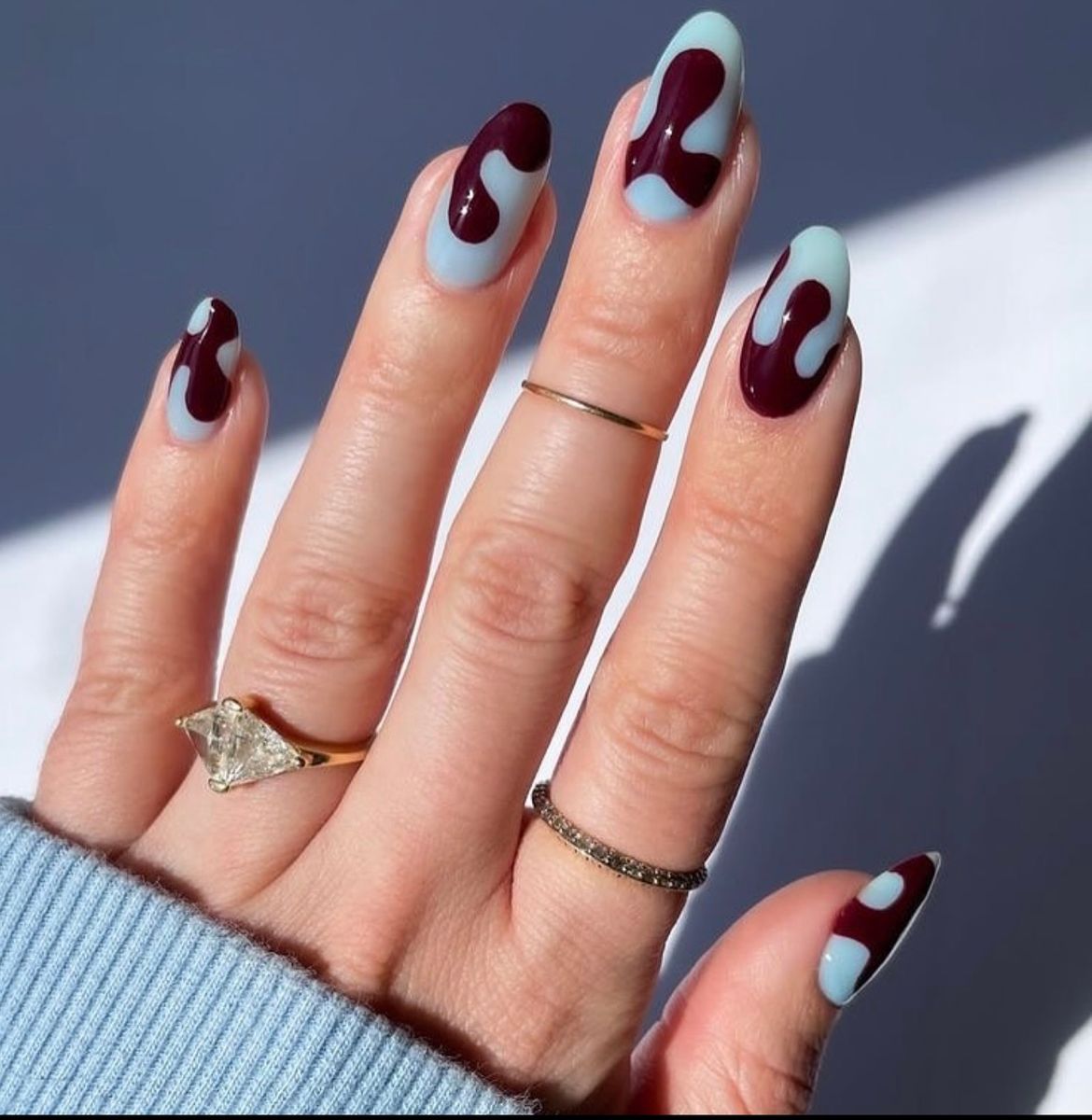 Blue and burgundy nails.