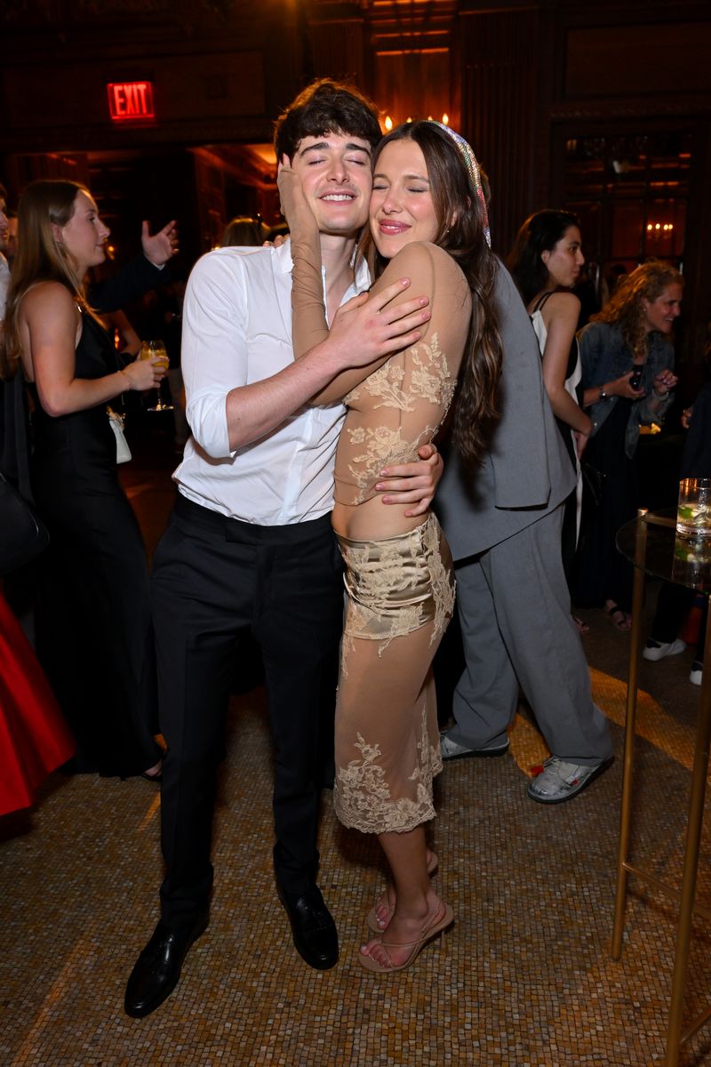 Millie Bobby Brown shared a heartfelt hug with longtime friend and 'Stranger Things' co-star Noah Schnapp during the after-party festivities.