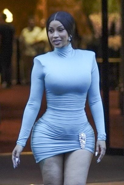 Cardi B turns heads in a blue dress as she greets fans in Paris