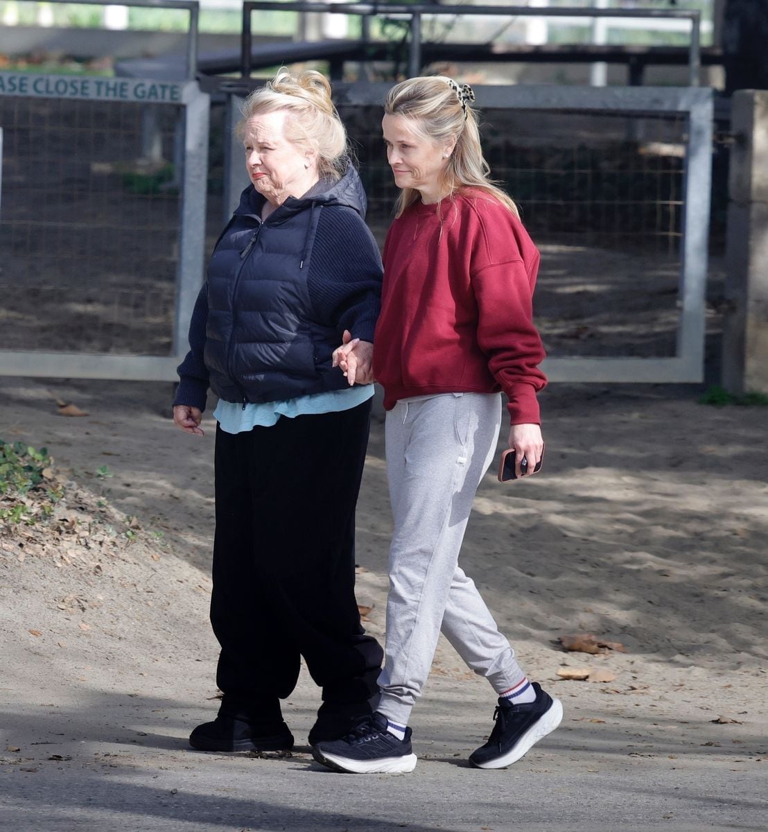 Reese Witherspoon goes make-up free and shows off her natural beauty as she takes a sweet walk with her mom, Betty.