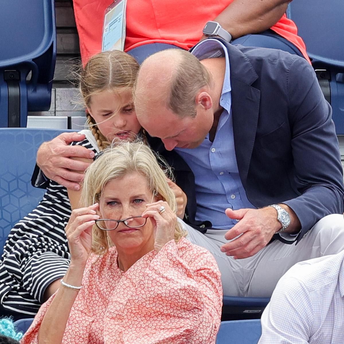 William sweetly hugged his daughter during a hockey match.