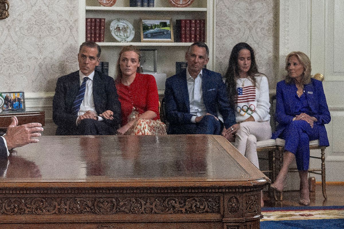 US President Joe Biden (L) speaks during an address to the nation about his decision to not seek reelection as his son Hunter Biden (2nd L), Hunter's daughter Finnegan Biden (3rd L), Ashley Biden's husband Howard Krein (C), Biden's daughter Ashley Biden (2nd R) and US First Lady Jill Biden (R) listen, in the Oval Office at the White House in Washington, DC, on July 24, 2024. US President Joe Biden will give an Oval Office speech July 24, 2024 to explain his historic decision to drop out of the 2024 election and pass the torch to Kamala Harris, with the White House denying any cover up over his health. In his first address to the nation since quitting the race, the 81-year-old is expected to burnish his legacy and deny he will spend six months as a lame duck president. (Photo by Jim WATSON / AFP) (Photo by JIM WATSON/AFP via Getty Images)
