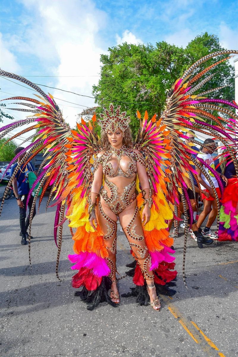 

Singer Rihanna Stuns at Carnival Festival In Barbados As She Poses With Police Officers In Her 2024 Outfit Consisting of Bewejeled Bra Head- To-Toe.