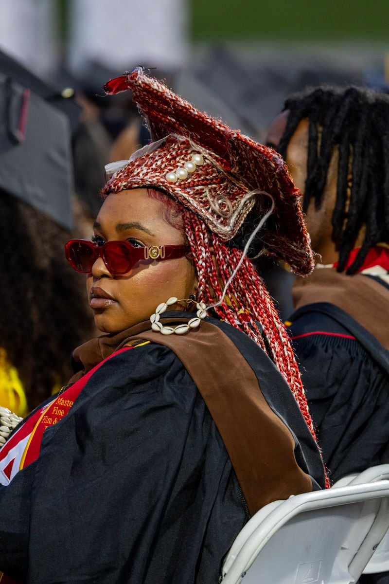 USC graduate Ashanti Damisi wears a cap that she made with braids to match her hair during the 2025 commencement ceremony at the Los Angeles Memorial Coliseum on Thursday, May 15, 2025, in Los Angeles, CA. 