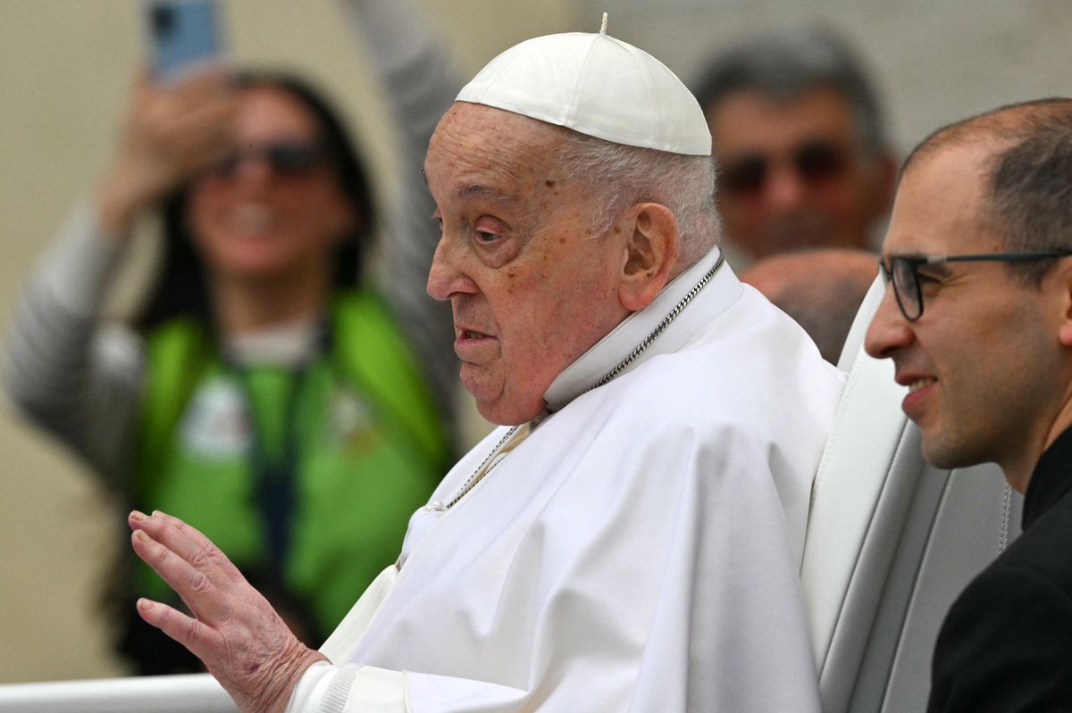 Pope Francis waves to the crowd from the popemobile after the Easter mass, at St Peter's Square in the Vatican on April 20, 2025