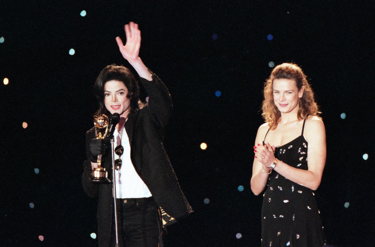 Michael Jackson receives a prize next to Princess Stephanie of Monaco during the World Music Awards on May 8, 1996 in Monaco