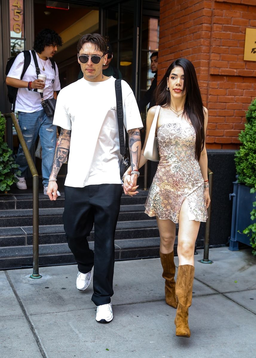 Mexican singer and rapper Peso Pluma and his girlfriend Kenia Os are seen holding hands and kissing in New York.