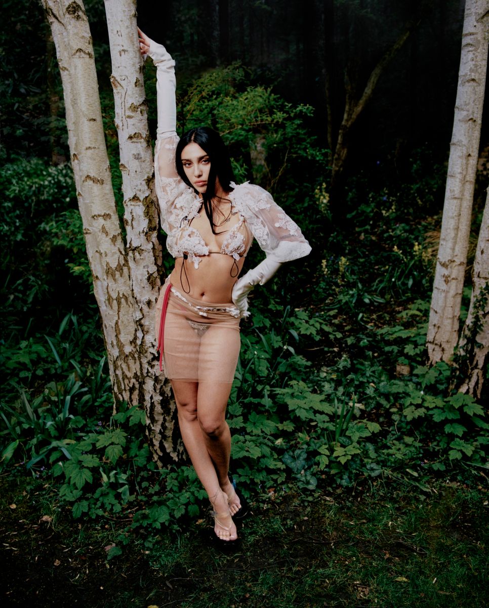 Lourdes Leon poses in sheer lace and dramatic skirt, channeling modern Renaissance glamour