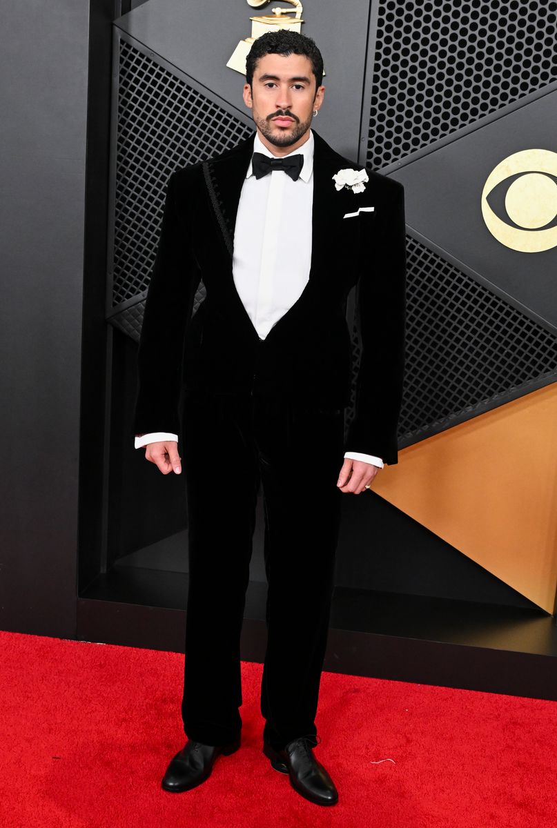 Bad Bunny finished the look with matching trousers, a white piqué cotton tuxedo shirt, and a black satin bow tie. 