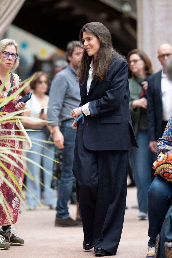 The Monegasque royal and author of La Grieta moves away from the '80s maximalism of her mother, Princess Caroline, opting instead for a masculine-inspired power suit at the Paris Book Fair.