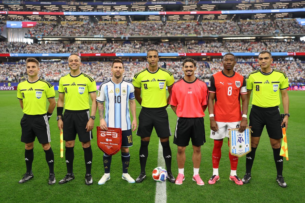 Captains David Alaba #8 of Austria and Lionel Messi #10 of Argentina pose with match officials at the coin toss before the FIFA World Cup 2026 Group J match between Argentina and Austria