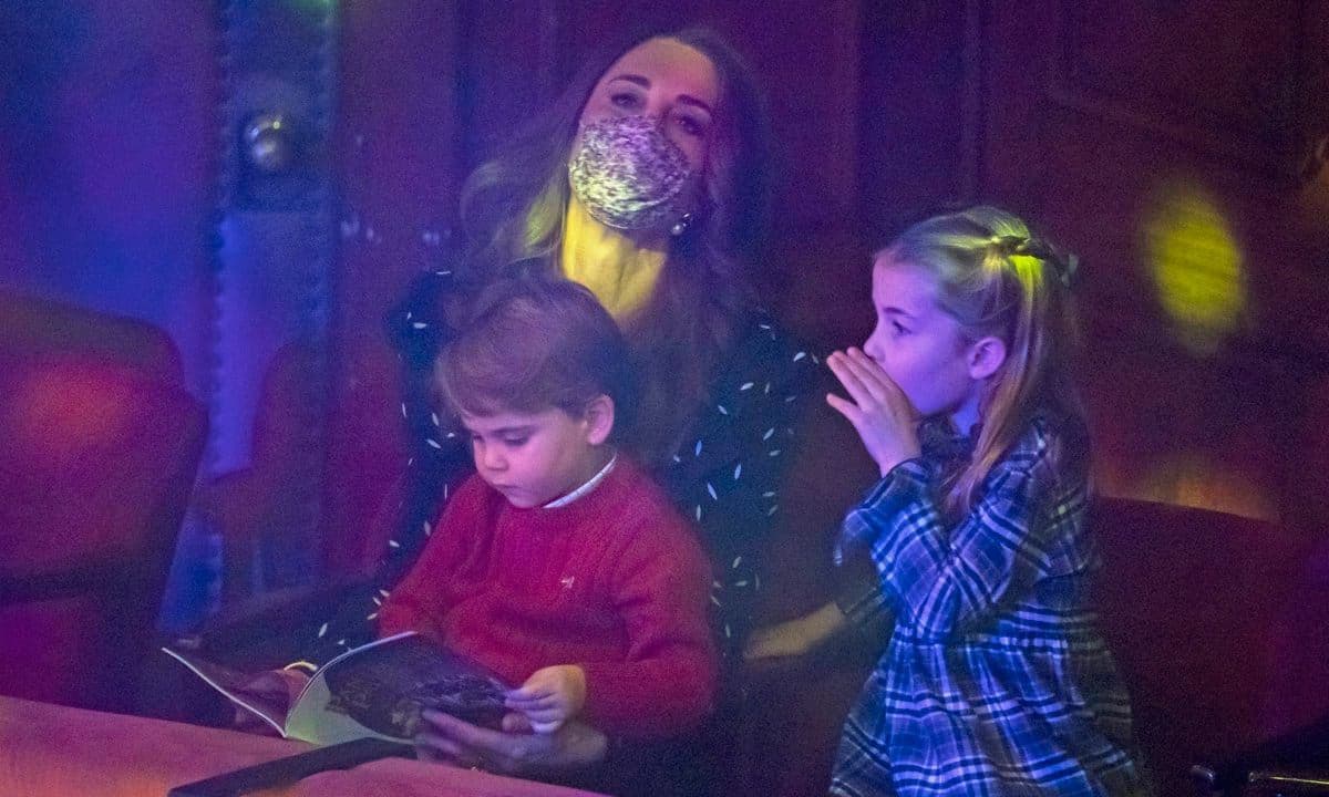 The Duke and Duchess' youngest son kept himself entertained with the show's program.