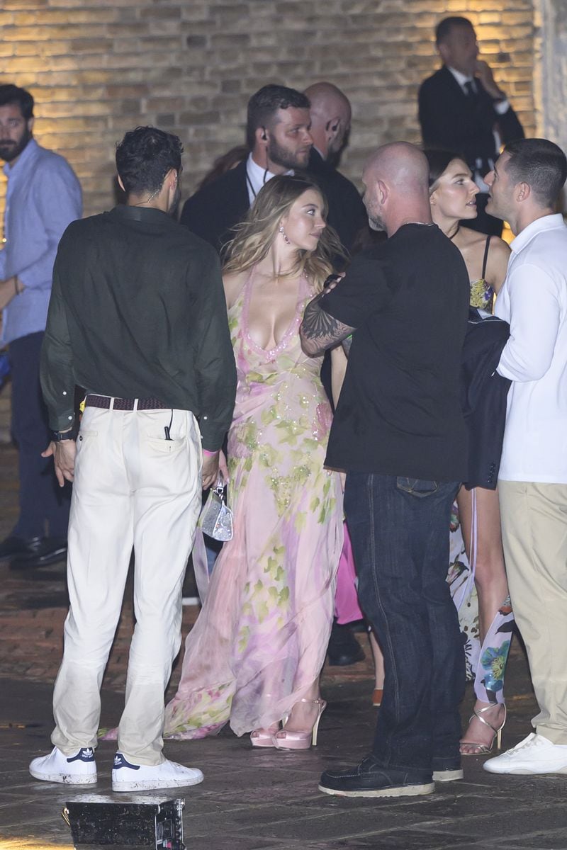 
 Her look was completed with long, loose waves and dangling earrings for a soft, romantic vibe.