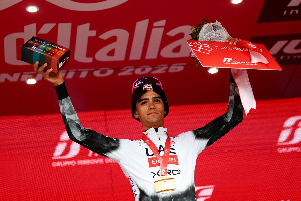 Mexican rider Isaac Del Toro celebrates on the podium after winning the 17th stage of the 108th Giro d'Italia cycling race