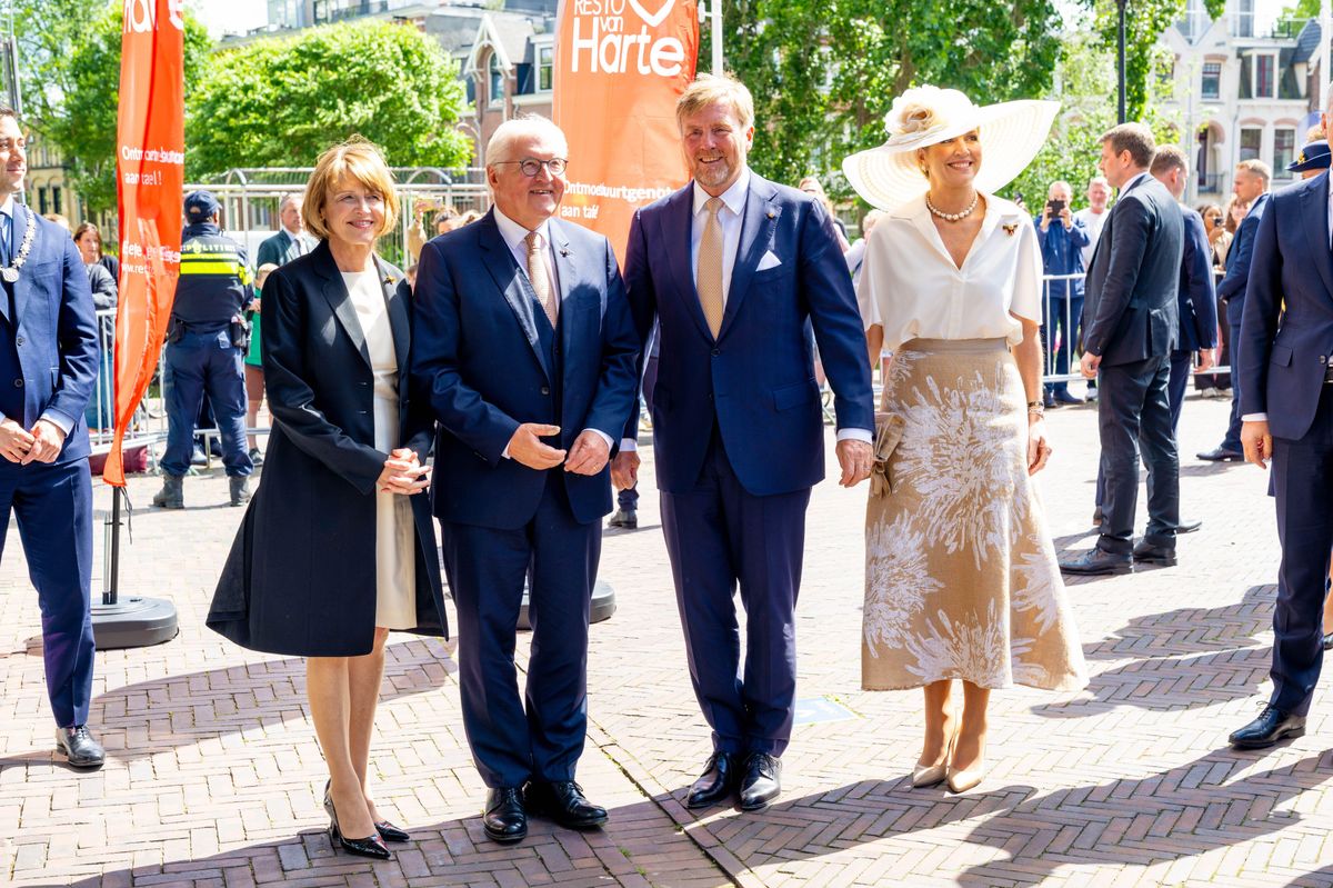 Queen Máxima completed her sophisticated daytime ensemble with nude Gianvito Rossi pumps and classic pearl jewelry.