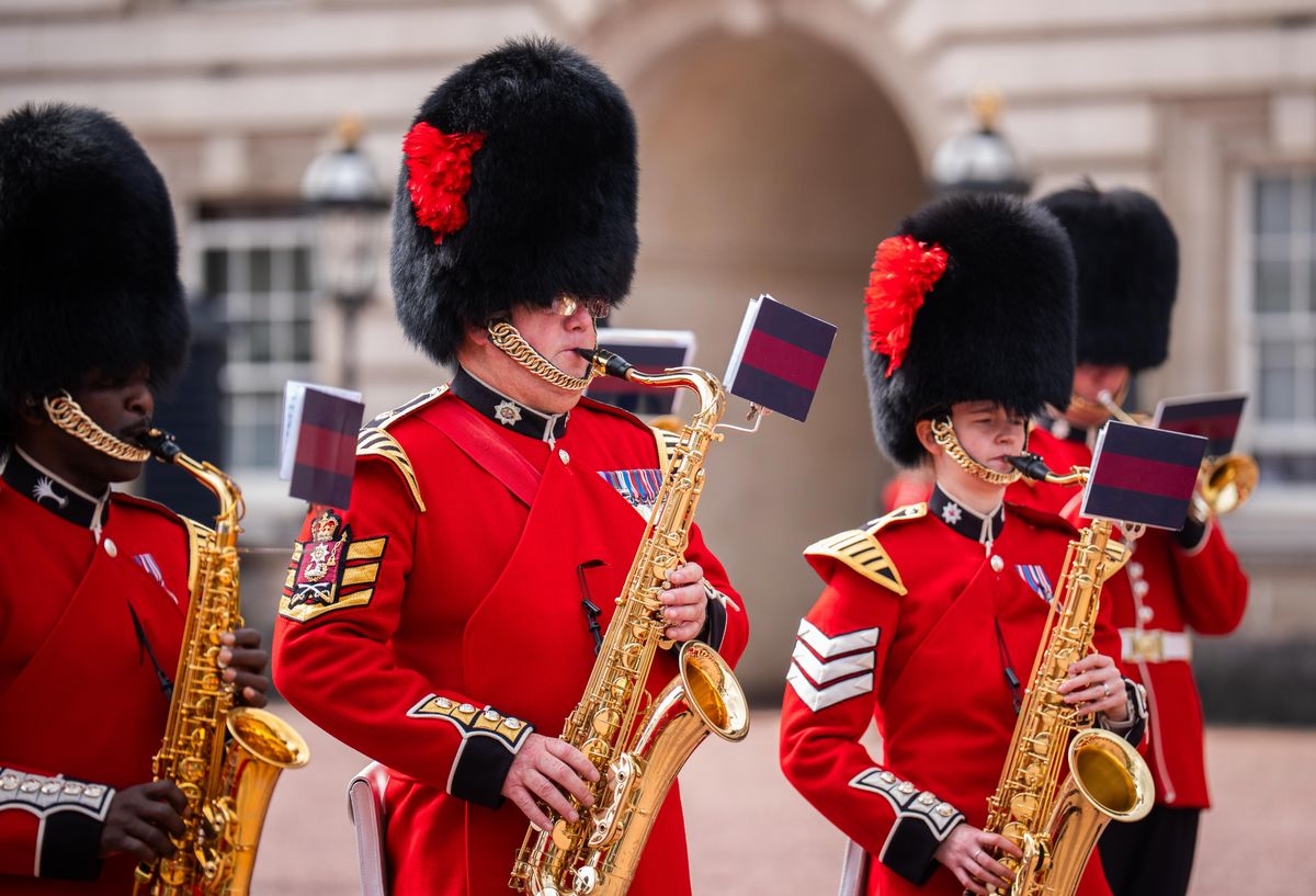 The Band of the Coldstream Guards performs Dolly Parton’s “9 to 5” during the Changing of the Guard at Buckingham Palace on August 26, 2026.