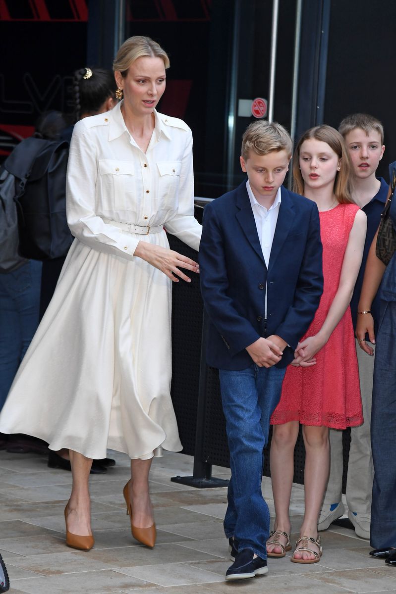 Princess Charlene's timeless white ensemble perfectly complemented Princess Gabriella's vibrant summer look.