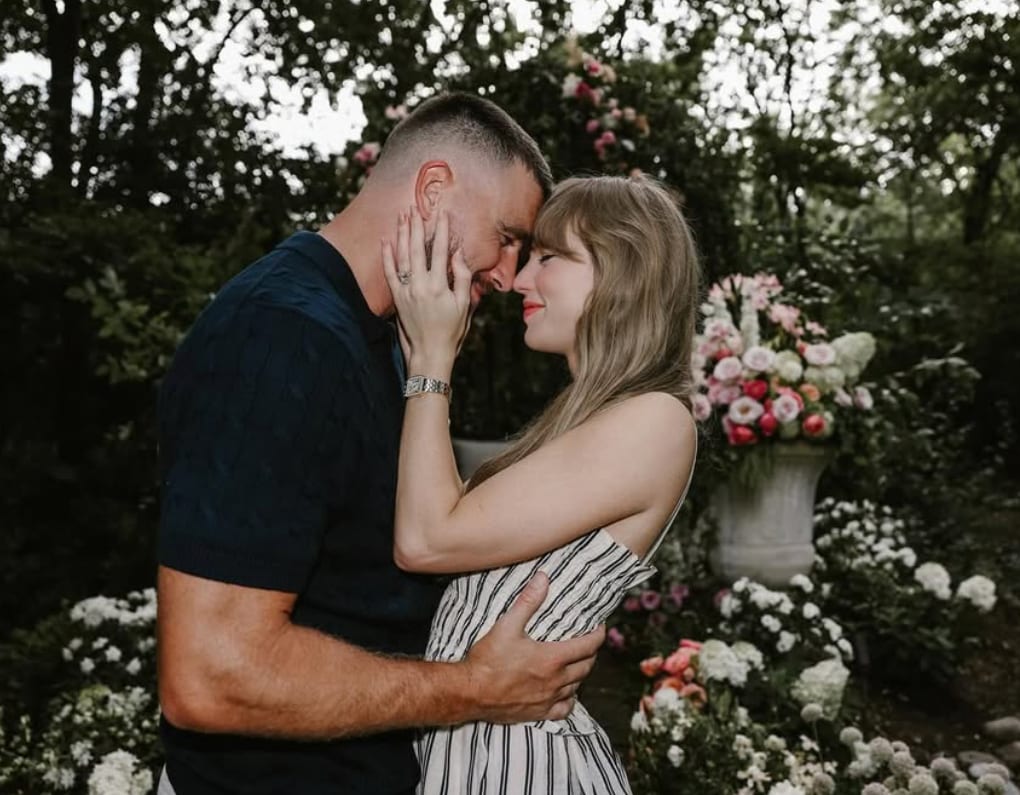 Taylor shared photos of the NFL tight end getting down on one knee.