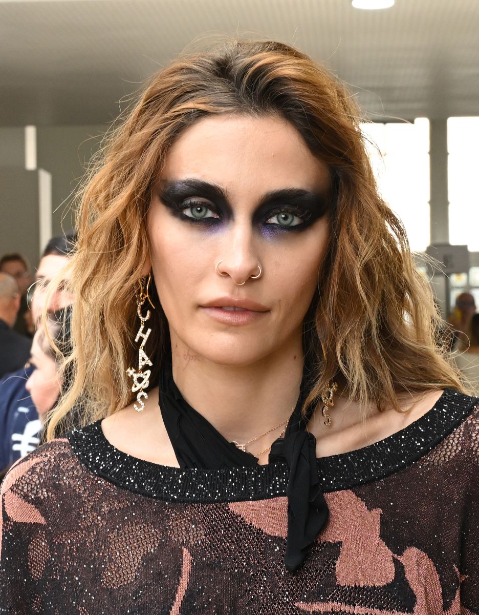 Black pigment stretched from Jackson’s lash lines toward her brows and temples, while shadow continued heavily underneath her eyes