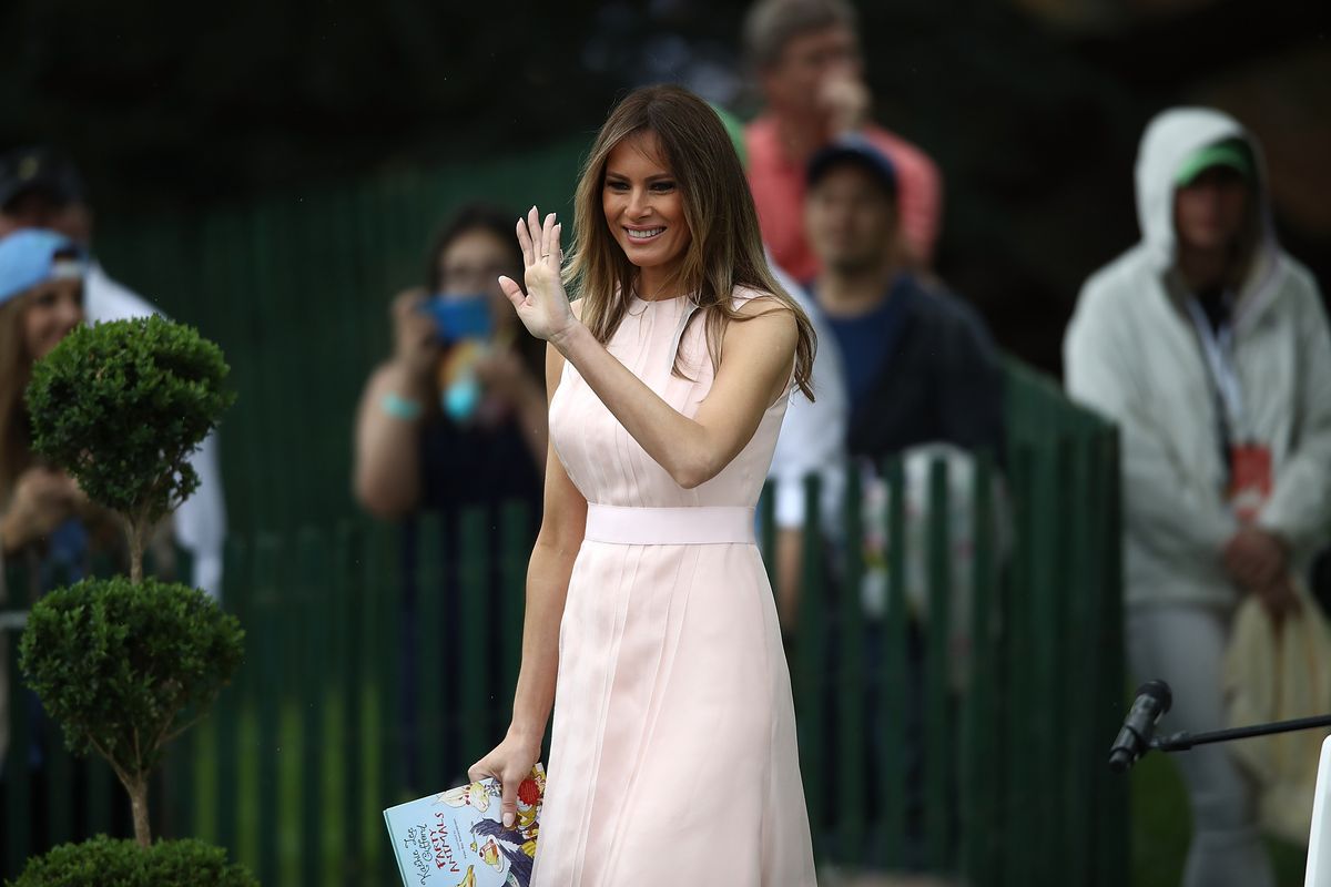 U.S. first lady Melania Trump waves before reading to children from the book "Party Animals" during the 139th Easter Egg Roll on the South Lawn of the White House April 17, 2017 in Washington, DC.