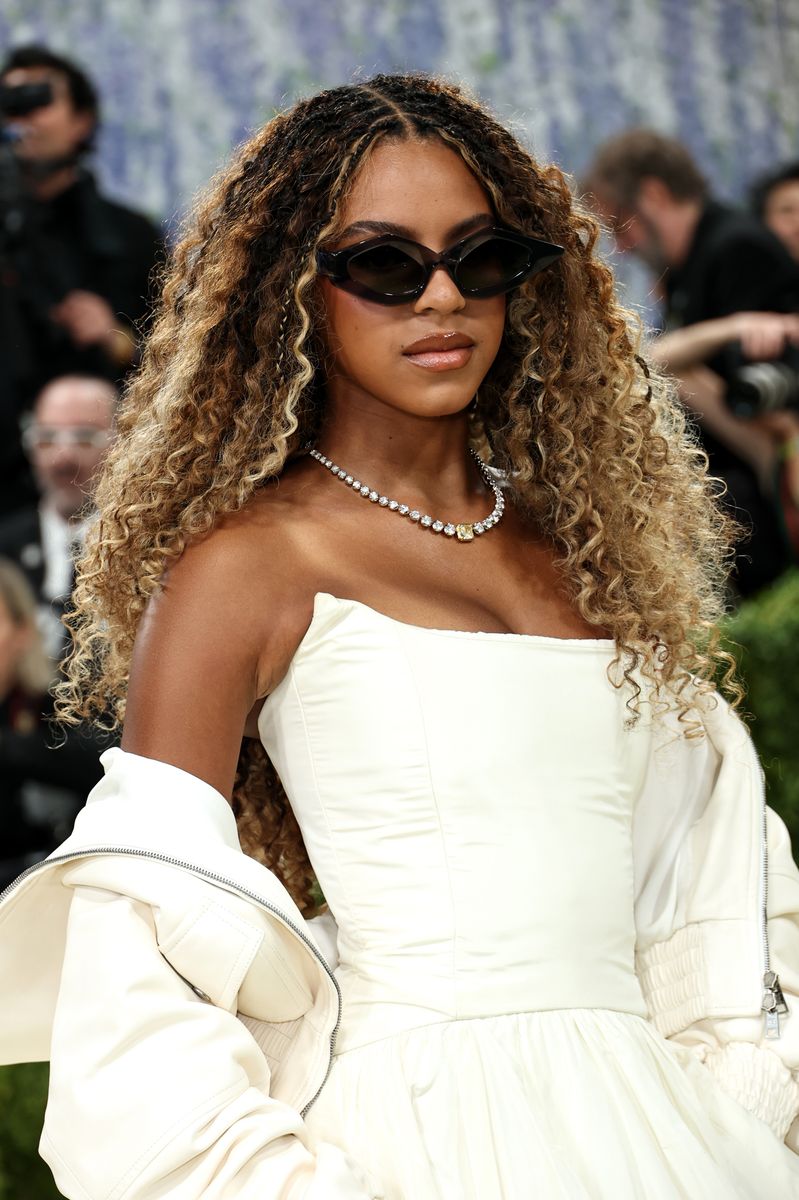 Blue Ivy Carter makes a historic Met Gala debut at 14, breaking age norms and delivering a standout Balenciaga look alongside Beyoncé and Jay-Z.