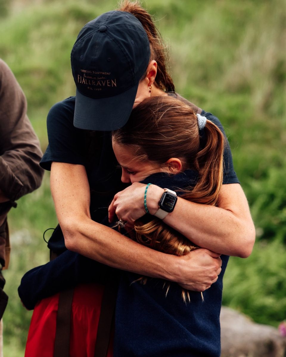 Princess Charlotte shares a hug with her mother as the family celebrates Kate’s completion of the mountain challenge.
