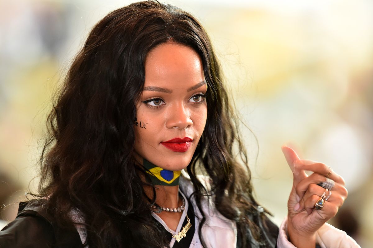 Barbadian singer Rihanna watches the 2014 FIFA World Cup final football match between Germany and Argentina at the Maracana Stadium in Rio de Janeiro on July 13, 2014.  AFP PHOTO / GABRIEL BOUYS        (Photo credit should read GABRIEL BOUYS/AFP via Getty Images)