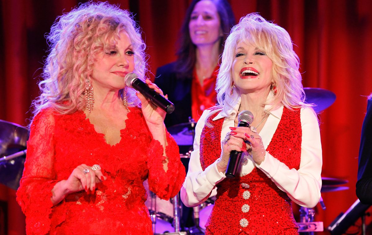 NASHVILLE, TN - APRIL 18: Stella Parton and Dolly Parton attend Stella Parton's Red Tent Women's Conference 2014 at the Doubletree Hotel Downtown on April 18, 2014 in Nashville, Tennessee. (Photo by Terry Wyatt/Getty Images)