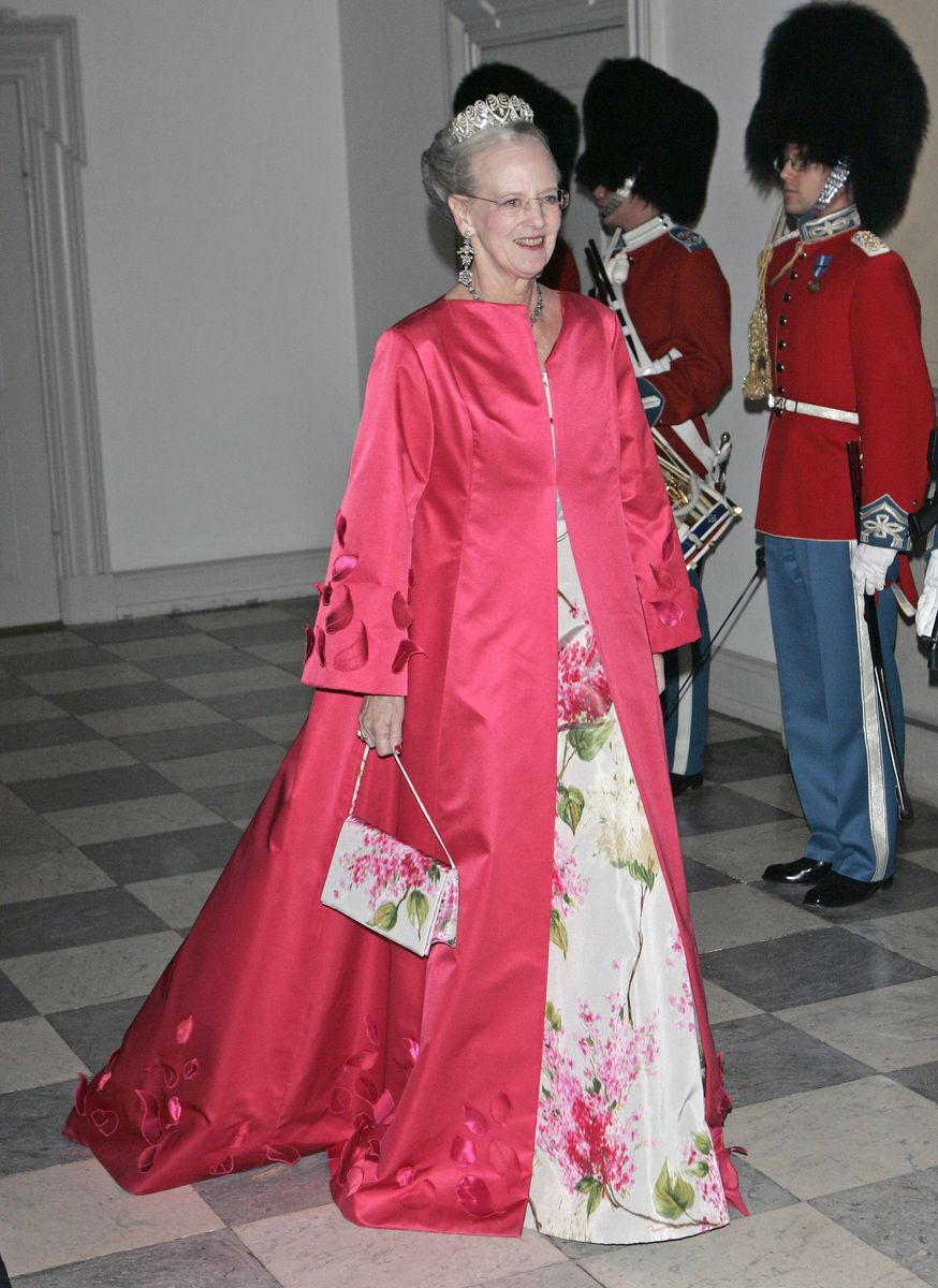 Queen Margrethe II of Denmark, pictured at a dinner at Christiansborg Palace, reigned for 52 years before passing the throne to her son, King Frederik X, who continues many of the royal traditions established during her reign.
